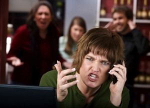 Annoying woman in a cafe on her cell phone